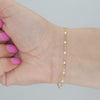 Video image preview for Finished Cable Bracelet with White Enamel Beads in 14K Yellow Gold (1.20 mm)